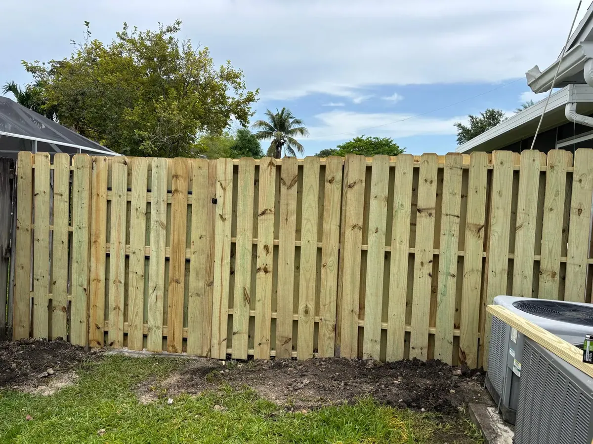 Wood Fence Installation New Pine Privacy Fence Pompano Beach by JC General Painting in South Florida