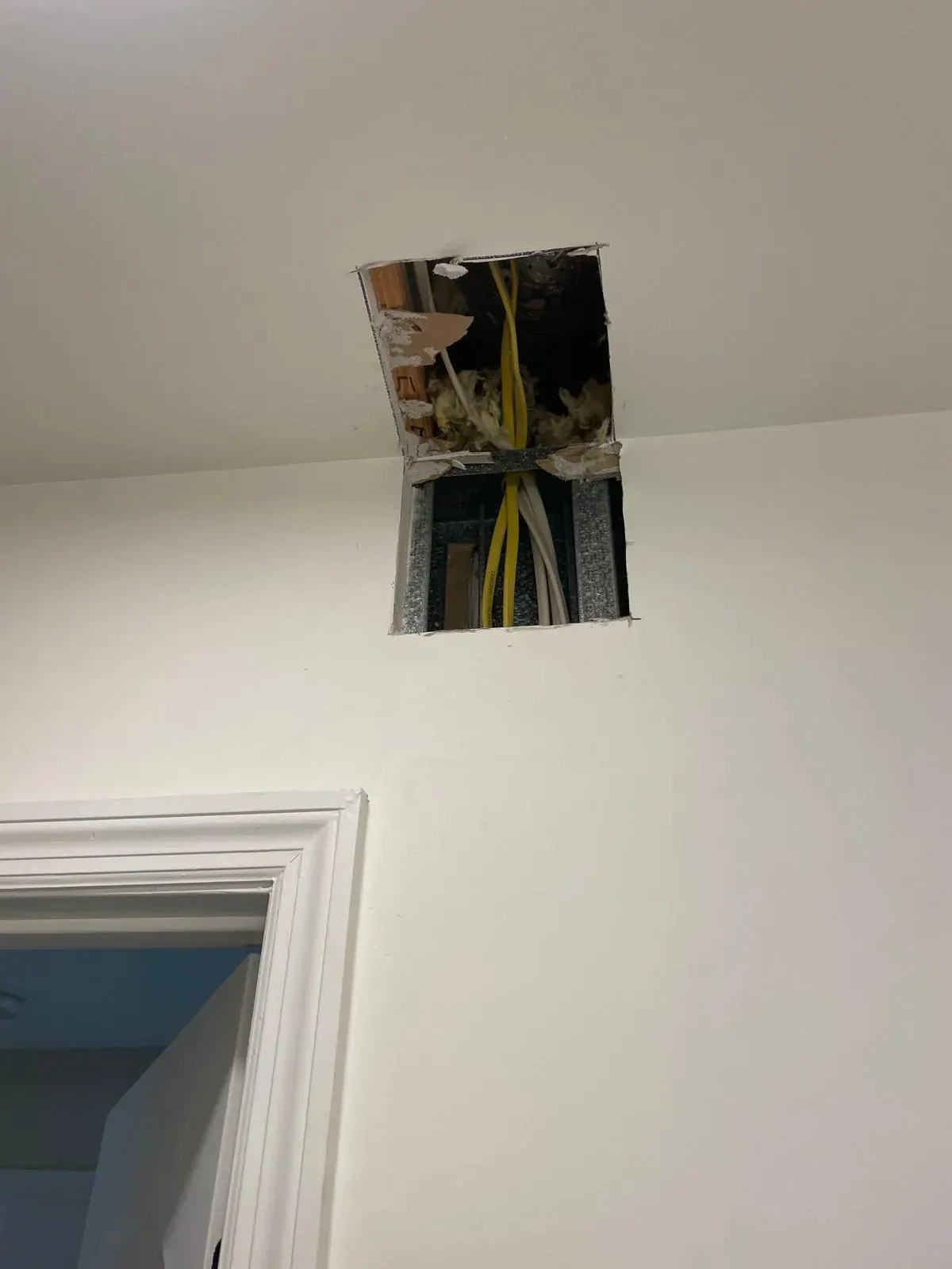 Ceiling access opening for wiring before drywall repair by JC General Painting in South Florida