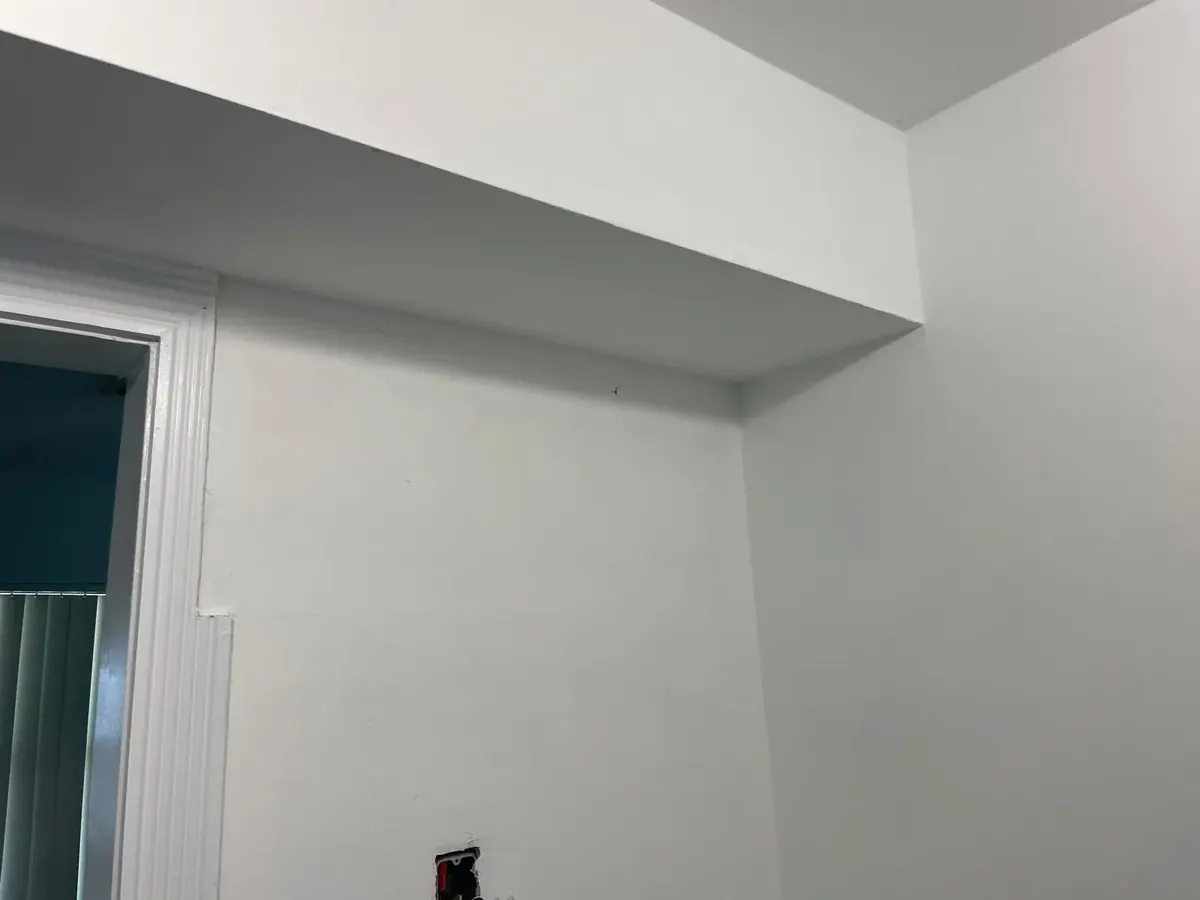 Freshly painted door casing and drop soffit by JC General Painting in South Florida