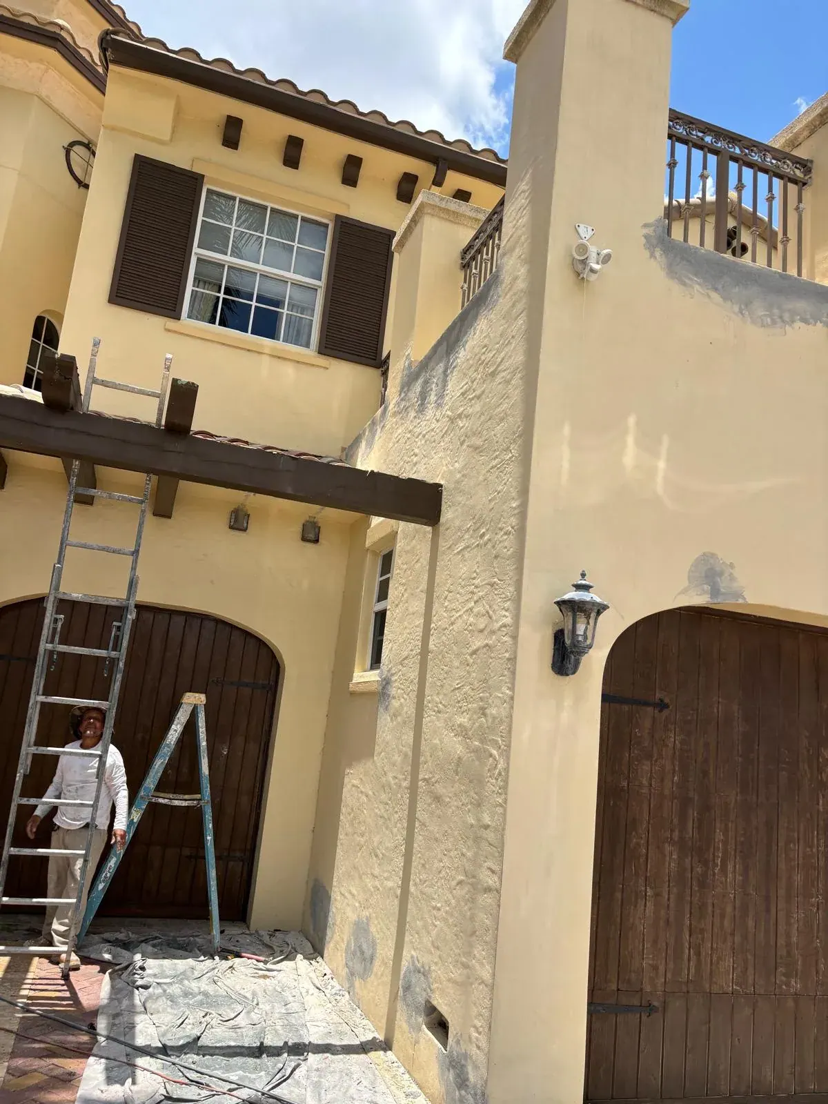Exterior House Painting Townhome Ladder by JC General Painting in South Florida