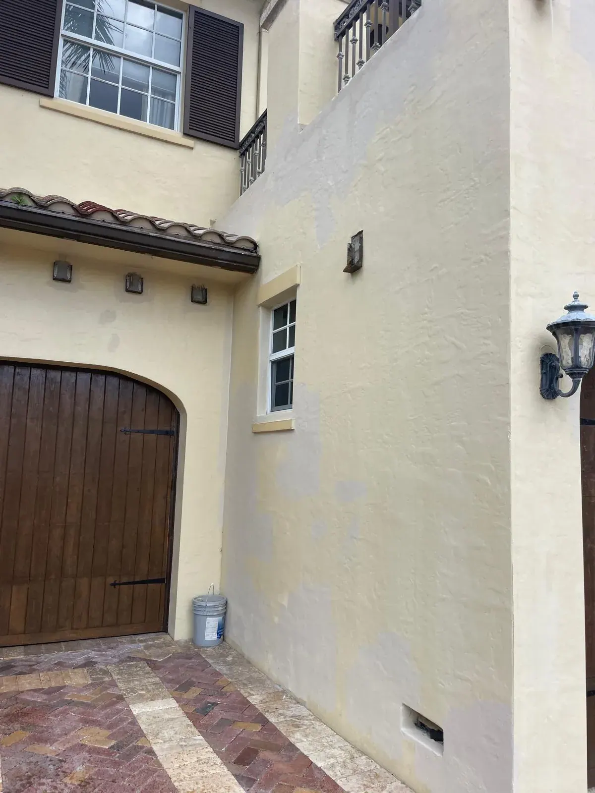 Exterior Stucco Painting Cream Facade Window by JC General Painting in South Florida