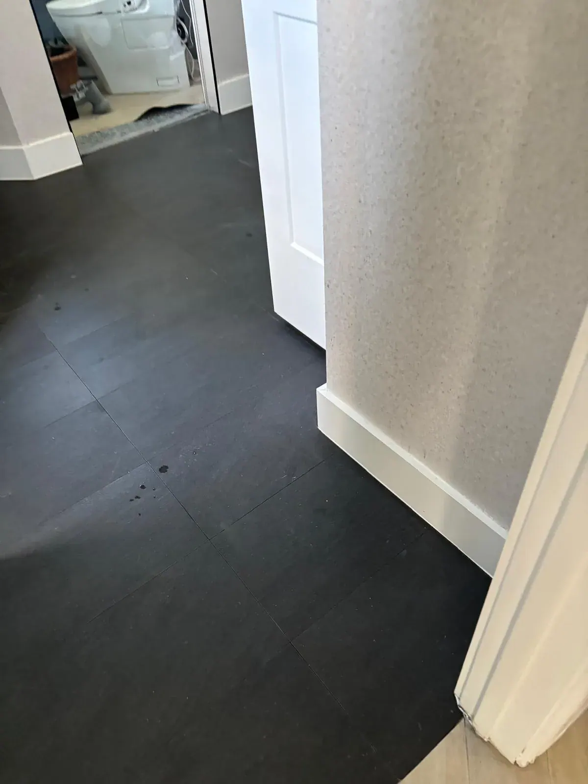 Interior Door Trim Painting White Door Dark Floor by JC General Painting in South Florida