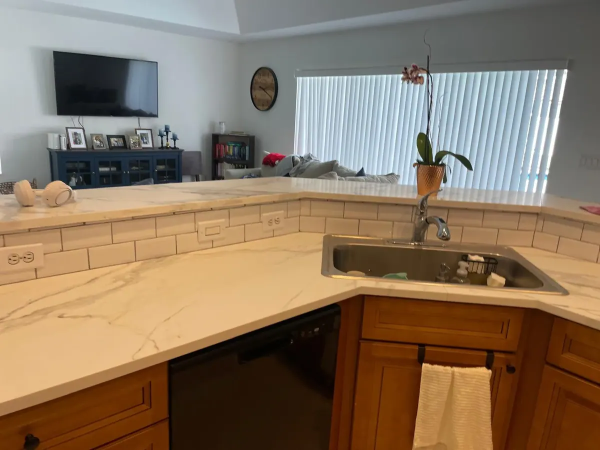 Kitchen with new marble countertops and white subway tile backsplash by JC General Painting in South Florida