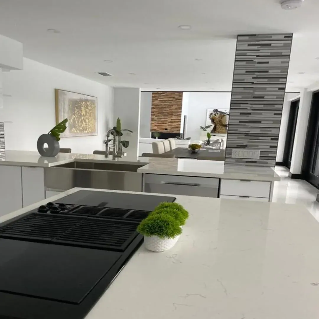 Modern kitchen and living area with stone accent by JC General Painting in South Florida