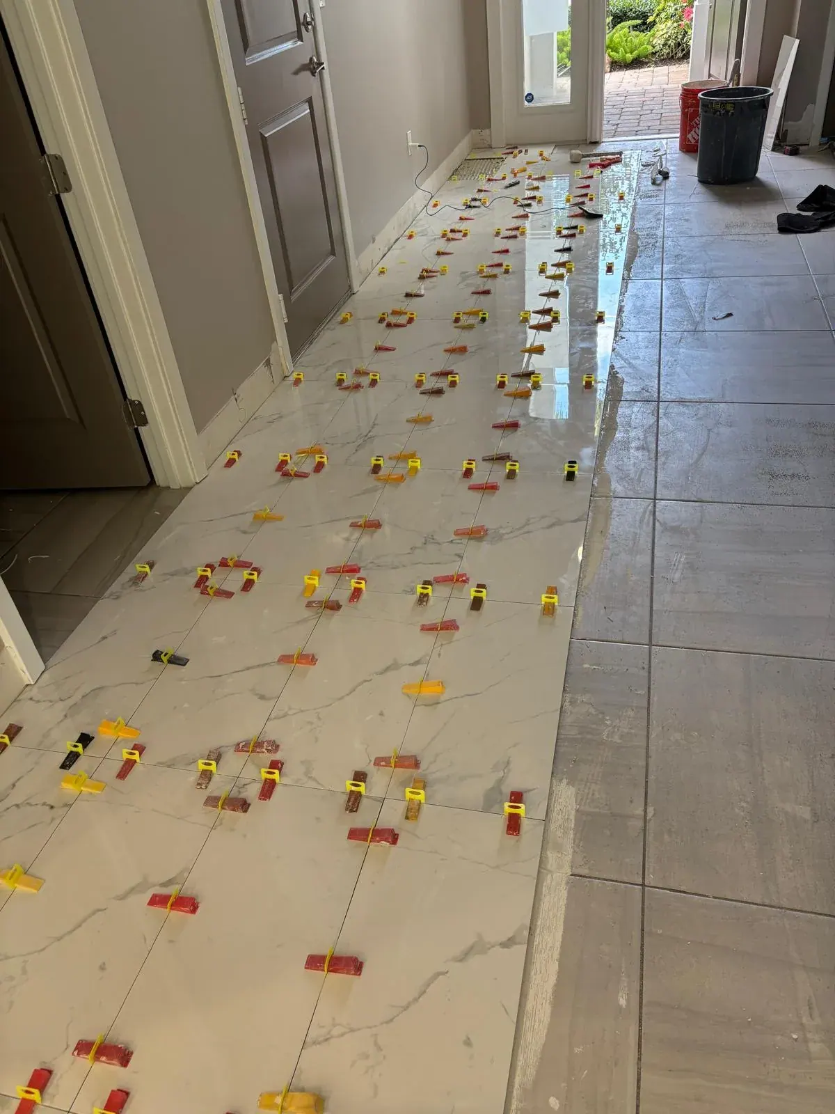Tile Flooring Installation Leveling Clips by JC General Painting in South Florida