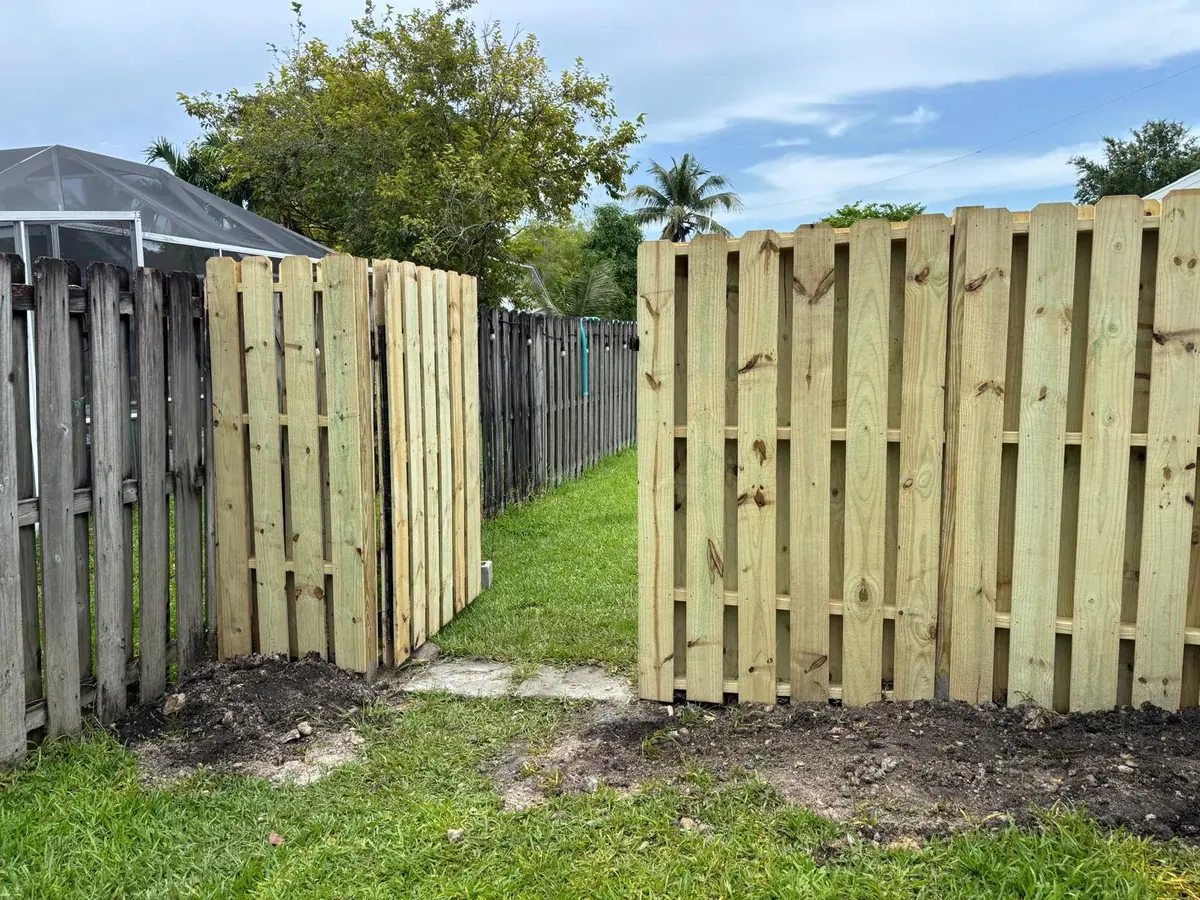 Wood Fence Installation Backyard Privacy Fence by JC General Painting in South Florida